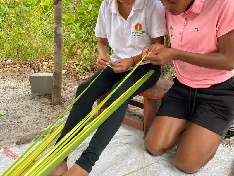 Weaving long green strands