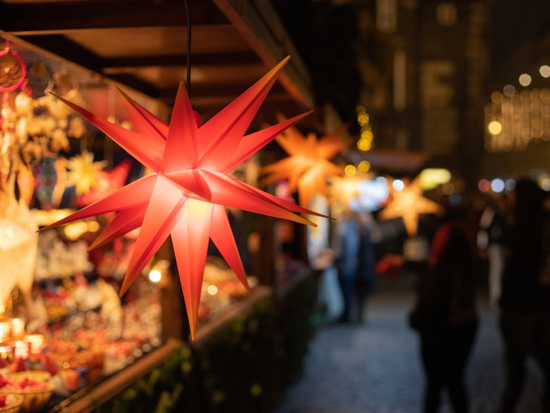Christmas stars in a sale booth on a his