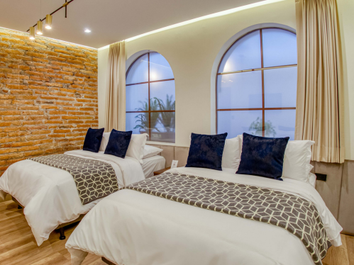 Familienzimmer mit zwei Queensize-Betten